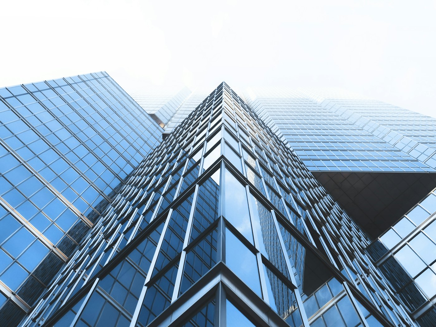 Glass office tower seen from below